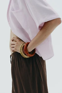 4-PACK OF WOODEN RAFFIA BRACELETS