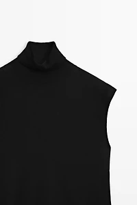 Asymmetric hem turtleneck top