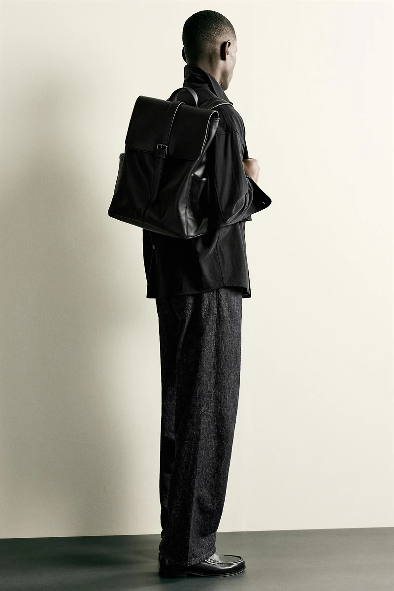 BELTED FLAP BACKPACK