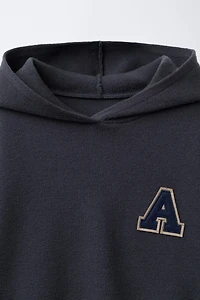 KNIT JUMPER WITH LETTER PATCH