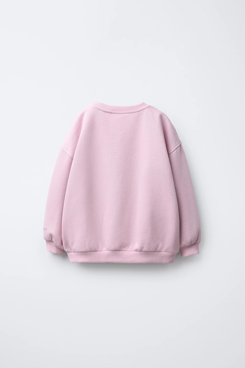 SWEAT ÉTOILE EN RELIEF BRILLANT