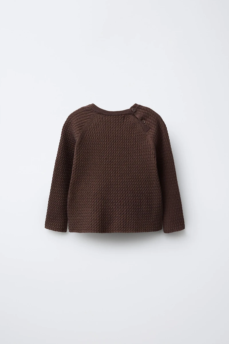 PULL EN MAILLE À TORSADES