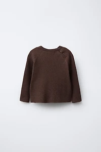 PULL EN MAILLE À TORSADES