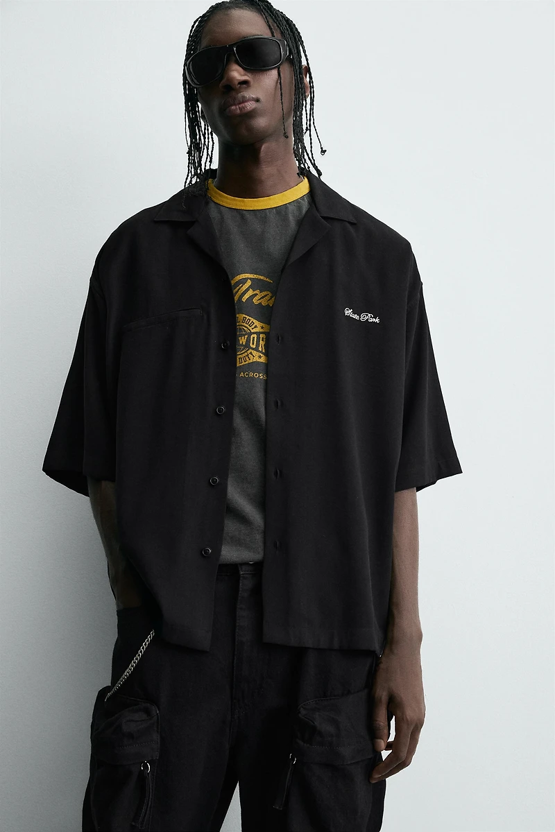 FLOWY SHIRT WITH EMBROIDERED TEXT