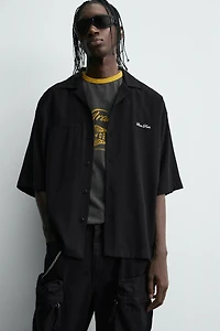FLOWY SHIRT WITH EMBROIDERED TEXT