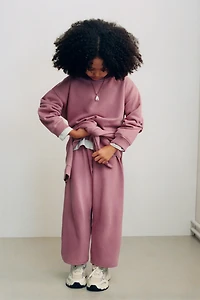 WIDE LEG RAISED TEXT PLUSH PANTS