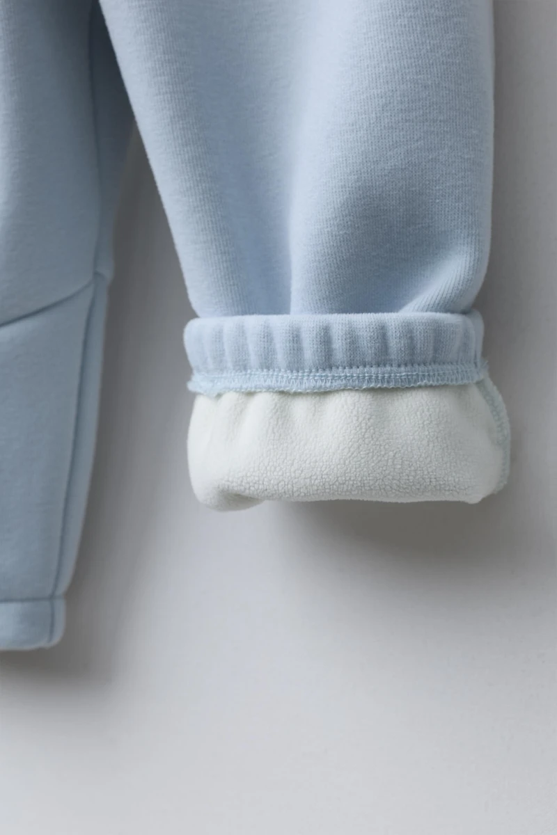 FLEECE LINED BAGGY PANTS WITH LOGO