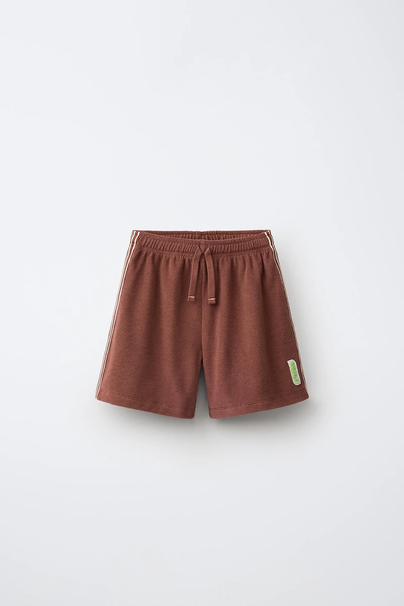 SHORT EN TISSU ÉPONGE PUKAS SURF