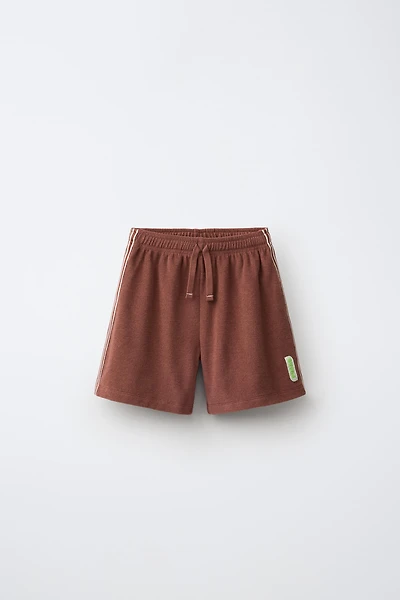 SHORT EN TISSU ÉPONGE PUKAS SURF