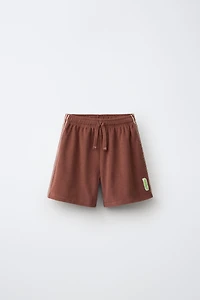 SHORT EN TISSU ÉPONGE PUKAS SURF
