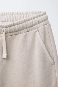 STRAIGHT FIT GRAFFITI CARGO PLUSH SHORTS