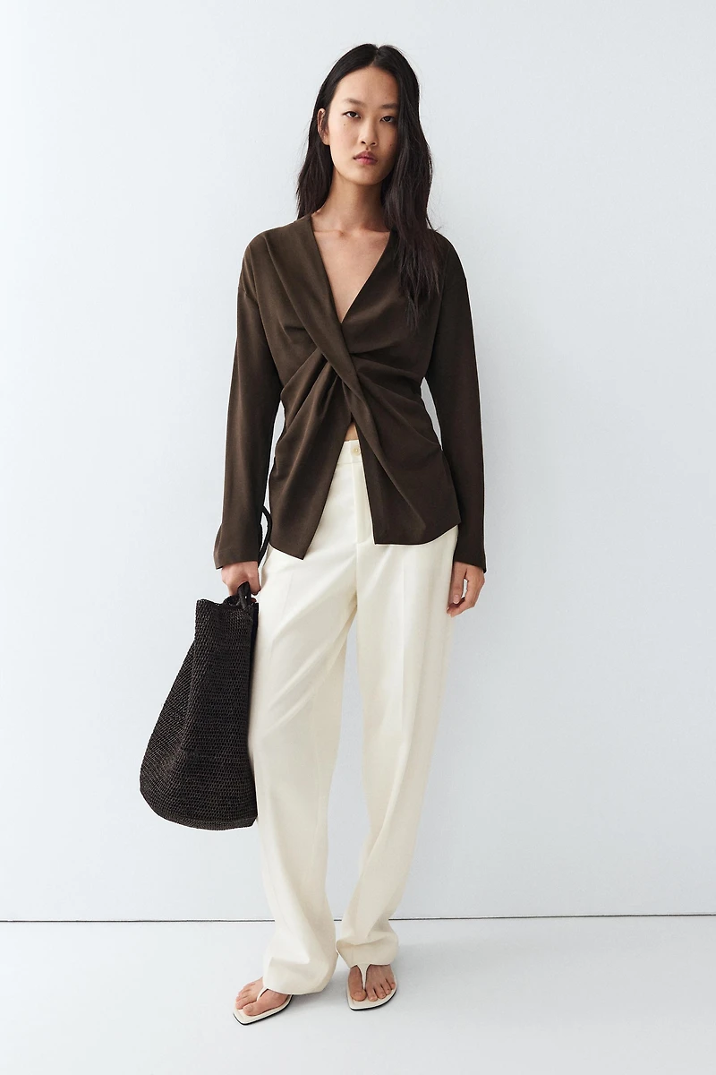 Flowing blouse with draped detail