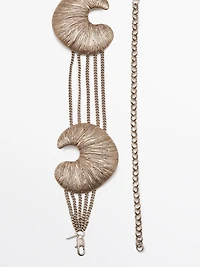 Belt with fossil pieces