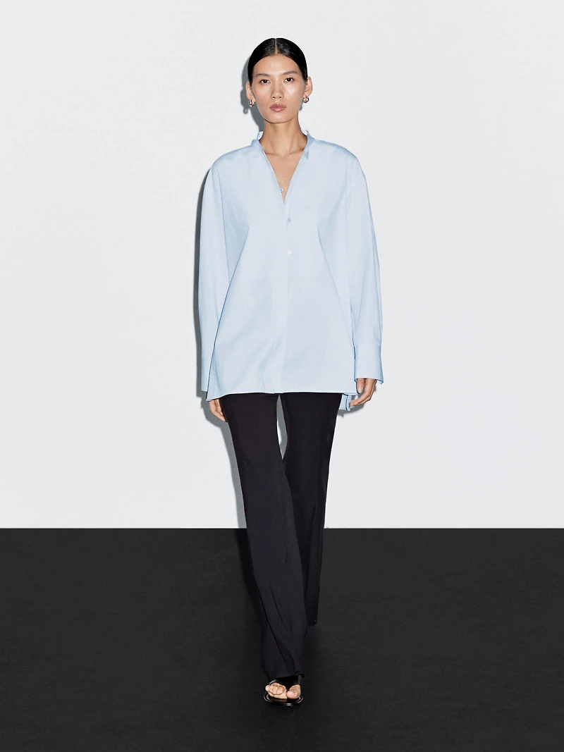 Shirt with stand collar and bib