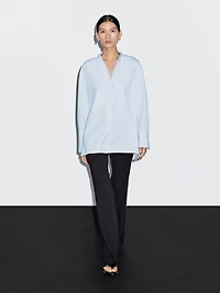 Shirt with stand collar and bib