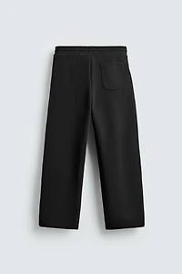 PANTALON BALLOON FIT EFFET NÉOPRÈNE PLISSÉ