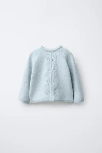 PULL EN MAILLE AVEC FEUILLES
