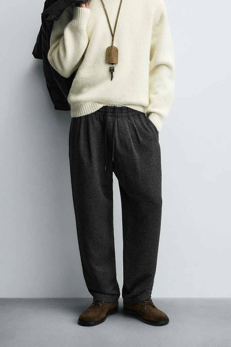 PLEATED WOOL PANTS