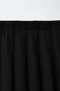 SOLID PLEATED SKIRT