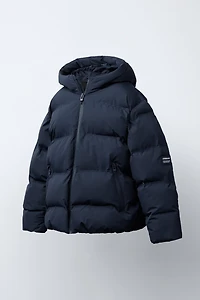 MANTEAU MATELASSÉ ÉTIQUETTE WATER REPELLENT