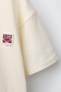 T-SHIRT UNI PIÈCE APPLIQUÉE