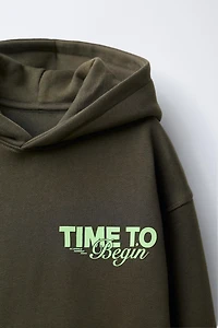 HOODIE WITH EMBOSSED TEXT PRINT