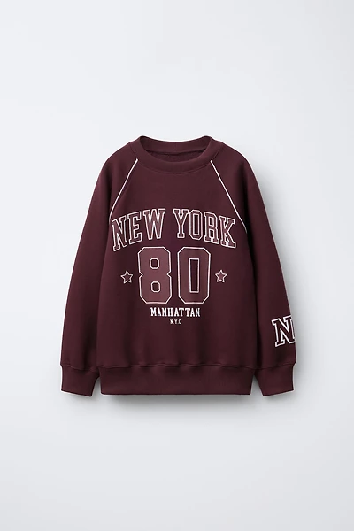 RAGLAN SLEEVE SWEATSHIRT WITH TEXT AND NUMBER