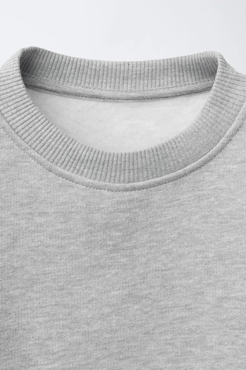 DOUBLE HEM LACE SWEATSHIRT