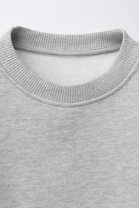 DOUBLE HEM LACE SWEATSHIRT