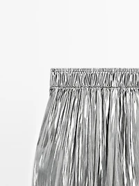 Flowing metallic trousers with gathered detail