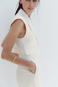 FLAP SHORT VEST