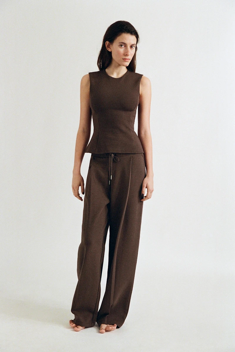 PEPLUM INTERLOCK TOP
