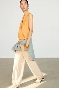 Flowing halter top with ruffle detail