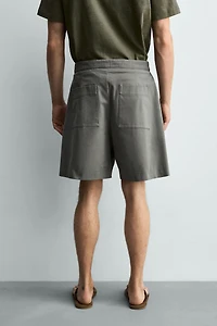 RELAXED FIT PLEATED BELTED SHORTS