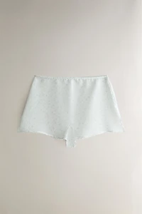 FLORAL PRINT SHORTS WITH SLITS