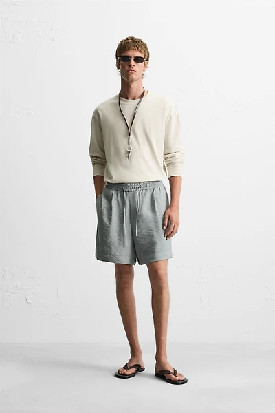 FLOWY RELAXED FIT BERMUDA SHORTS