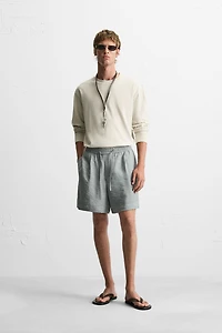 FLOWY RELAXED FIT BERMUDA SHORTS
