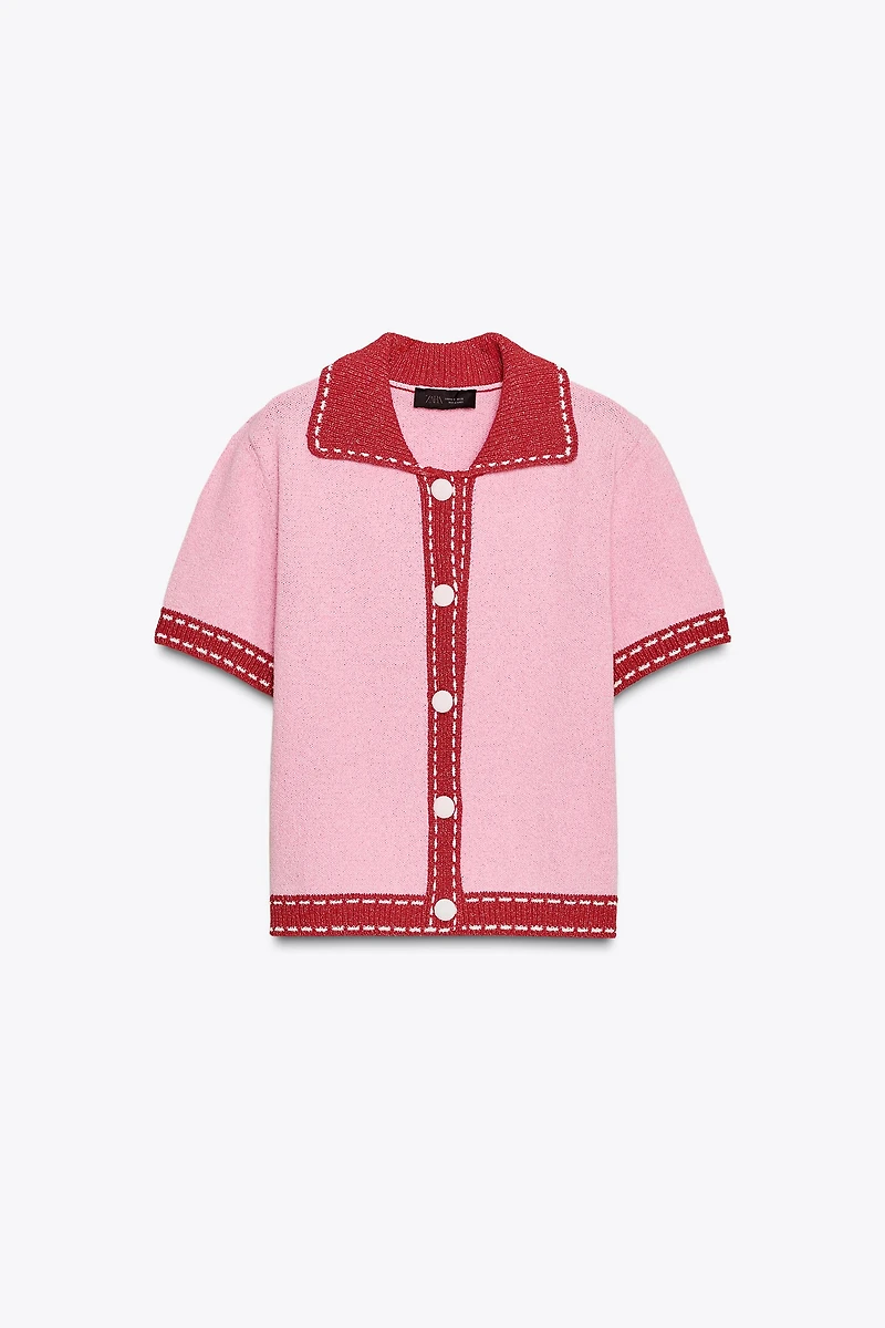VESTE EN MAILLE SURPIQÛRES MANCHES COURTES