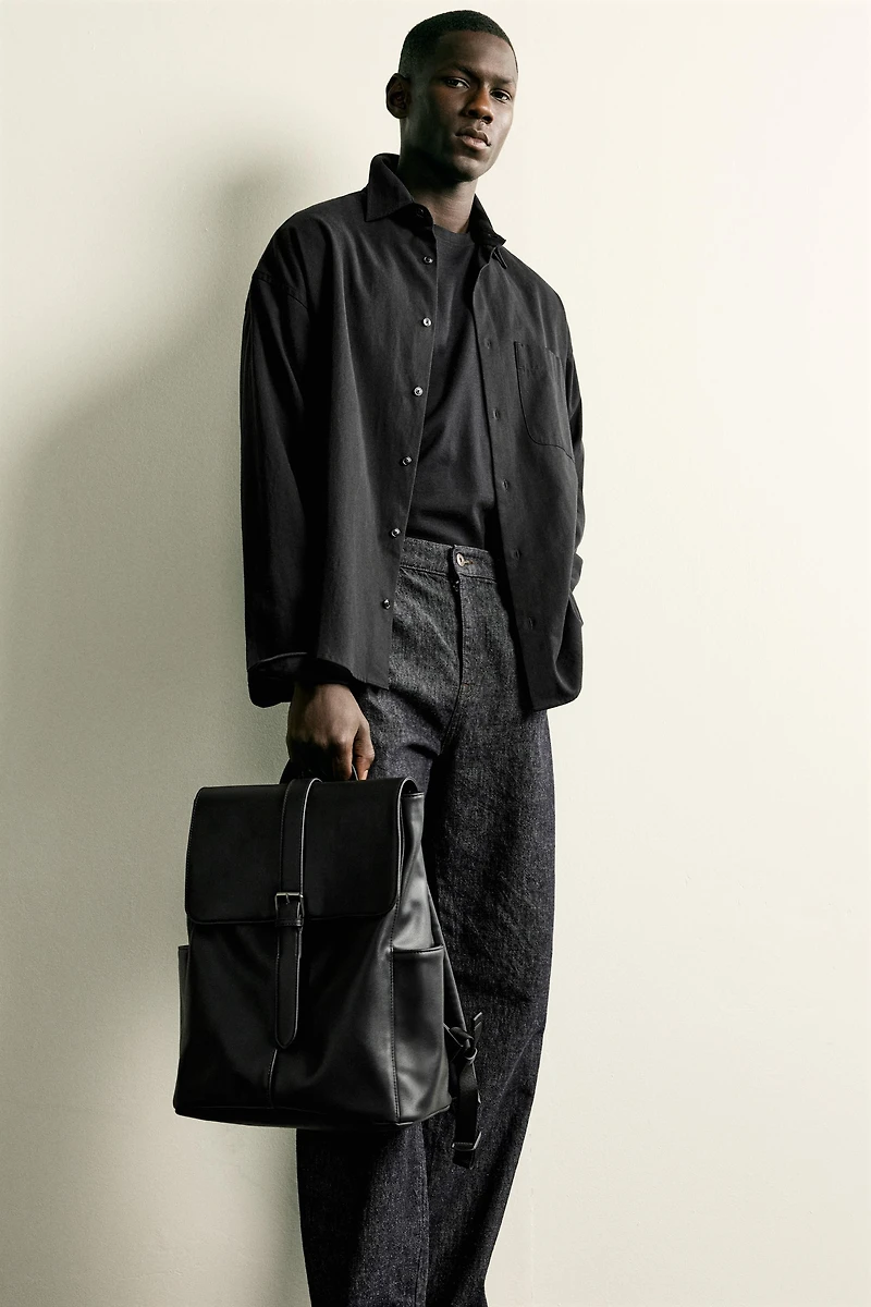 BELTED FLAP BACKPACK