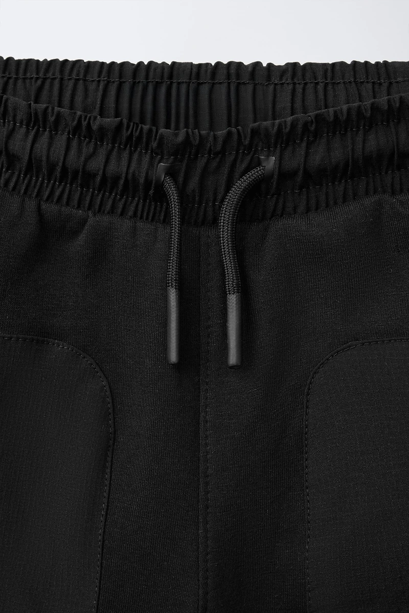 BERMUDA SPORT EN MATIÈRES VARIÉES