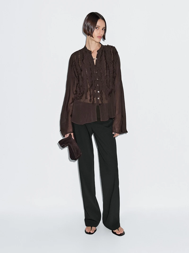 Flowing bib-front shirt with ruffles