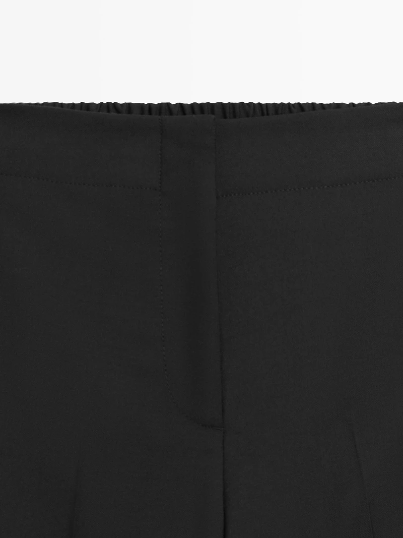 100% wool cropped wide-leg elasticated trousers