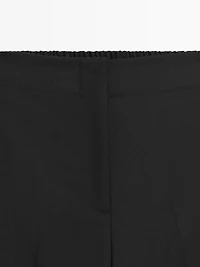 100% wool cropped wide-leg elasticated trousers