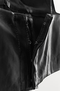 TOP TRIANGLE EN CUIR