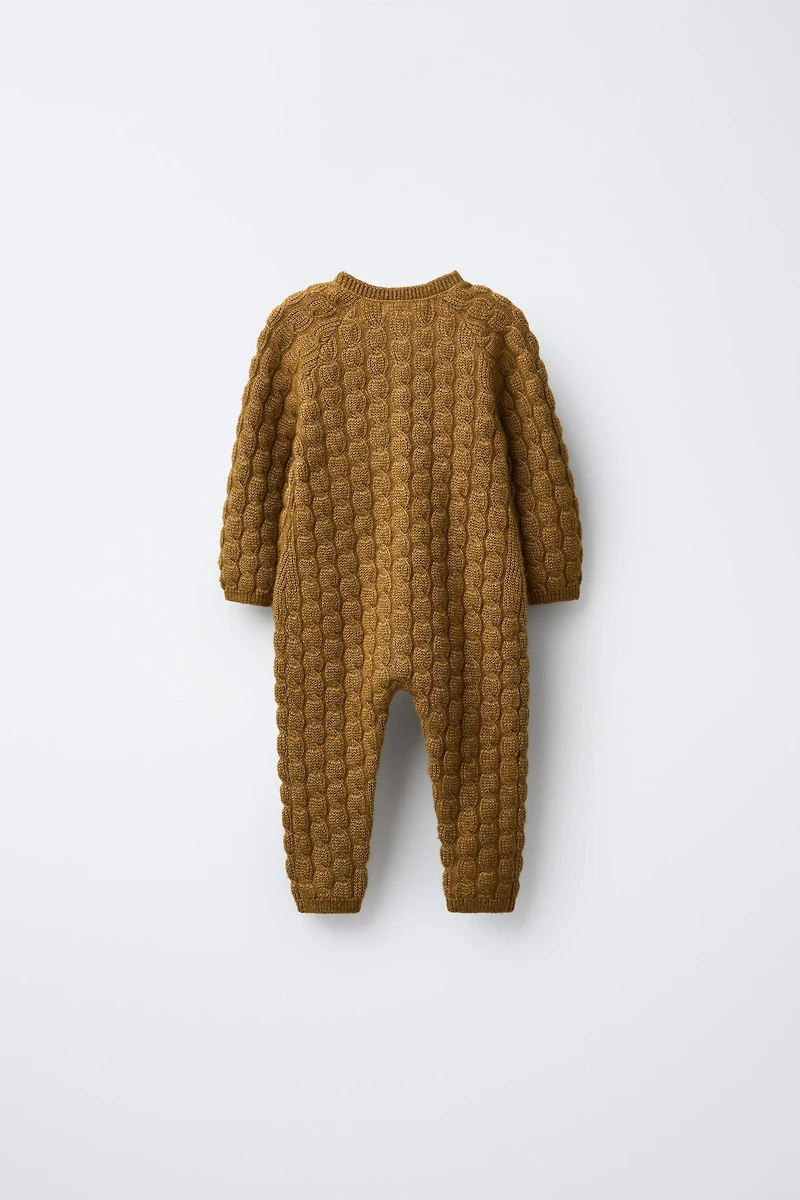 COMBINAISON LONGUE EN MAILLE TORSADÉE