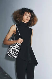 SLEEVELESS PEPLUM TOP