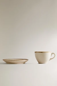 PORCELAIN TEACUP WITH ANTIQUE FINISH RIM
