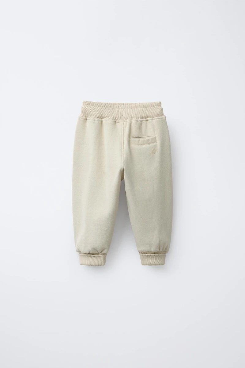 FLOCKED LOGO JOGGER PANTS