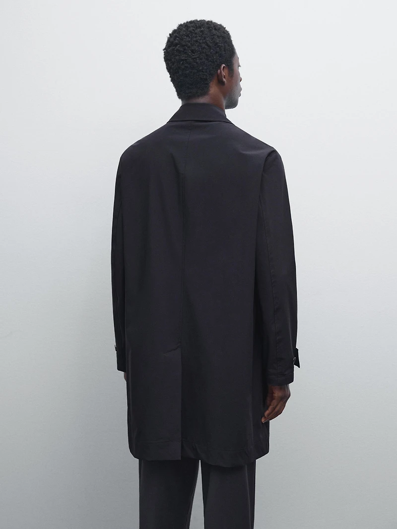 Lightweight trench coat with hidden buttons