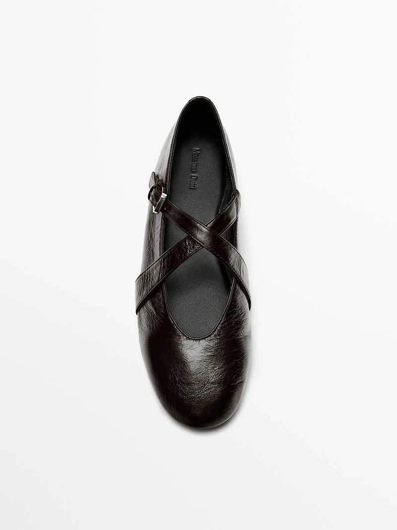 Ballet flats with criss-cross straps and buckle